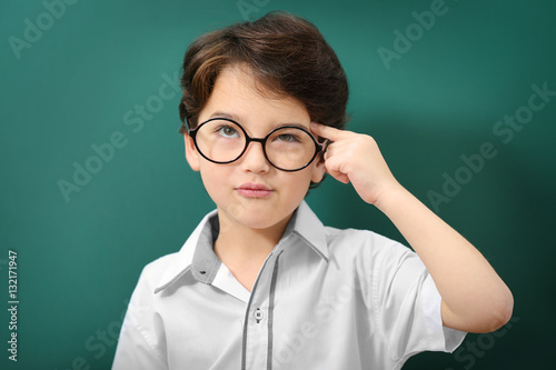 Cute little boy in glasses ...