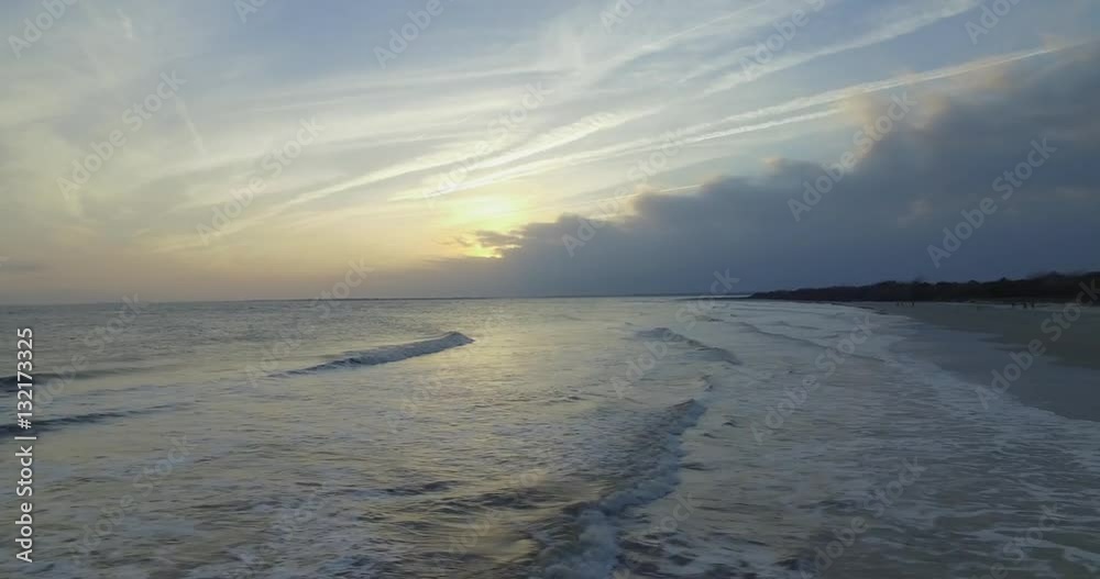 Aerial shot of Sullivan’s Island beach at sunset with a storm approaching. Aerial shot of Sullivan’s Island beach at sunset with a storm approaching.