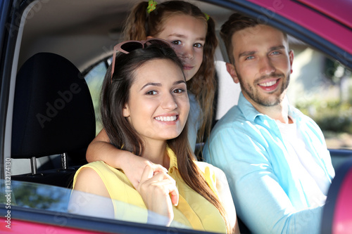 Family with kids in car