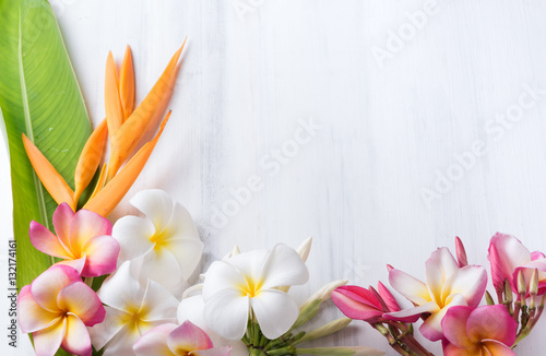 white wood texture with Heliconia and plumeria flower
