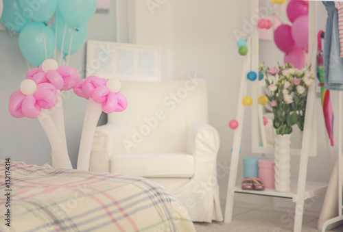 Colorful balloons in room d...