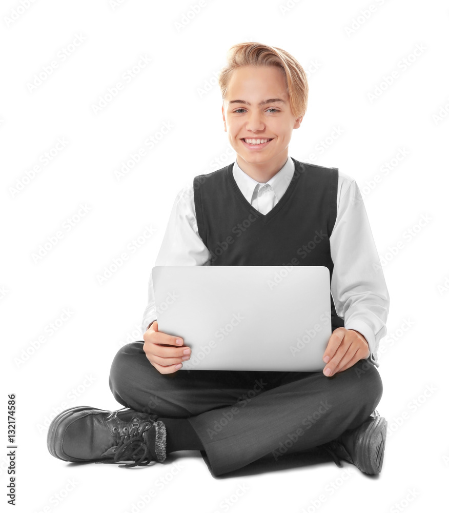 Teenage boy with laptop sitting on white background Teenage boy with laptop sitting on white background