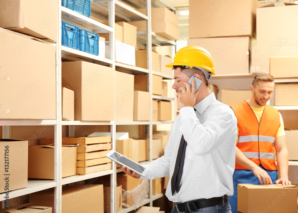 Young businessman with tablet at warehouse Young businessman with tablet at warehouse