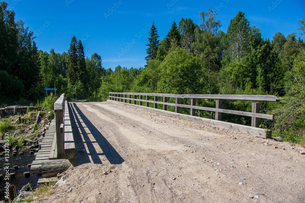 Wooden bridge across the river in Karelia Wooden bridge across the river in Karelia