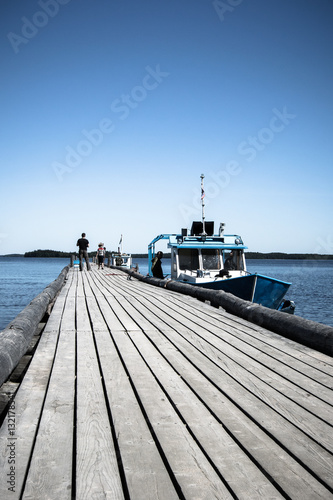 Wooden jetty on the lake in Karelia photo