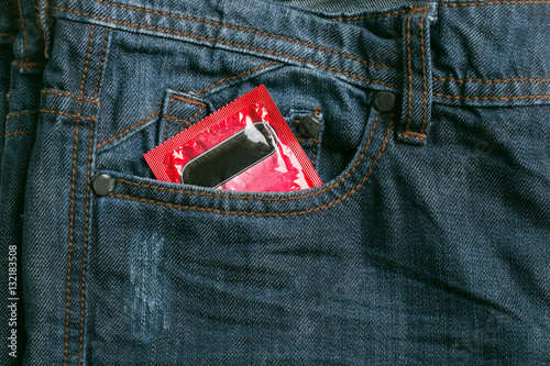 Condom package in back pocket jeans. Protect HIV and for world A