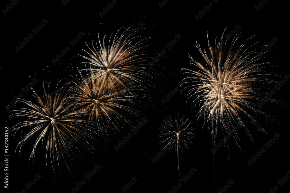 Fototapeta premium Festive fireworks colorful display isolated in bursting shapes on black background. Happy new year 2017. Beautiful light for celebration. Show explosion wallpaper during eve. Abstract blur dark scene.