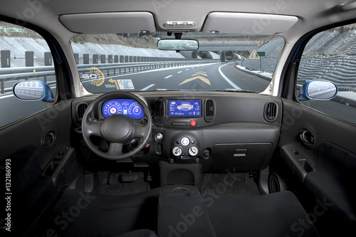 empty cockpit of vehicle, HUD(Head Up Display) and digital speedometer © metamorworks