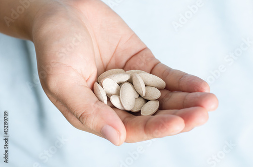 Medicine herb in hand,Alternative medicine,Herbal supplement pill