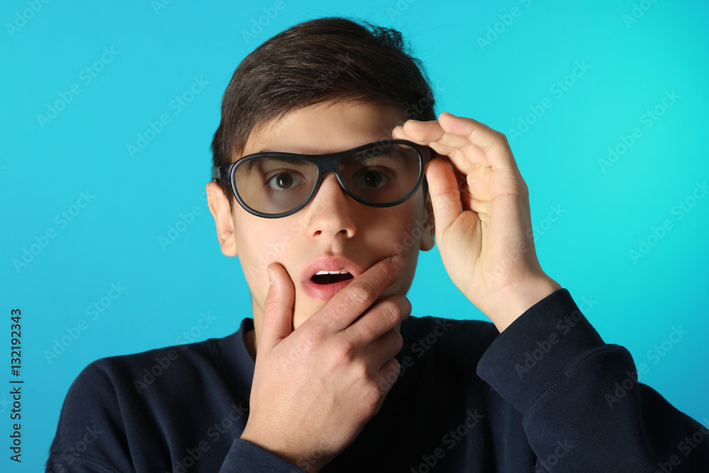 Young man in 3D glasses on a blue background. Young man in 3D glasses on a blue background.