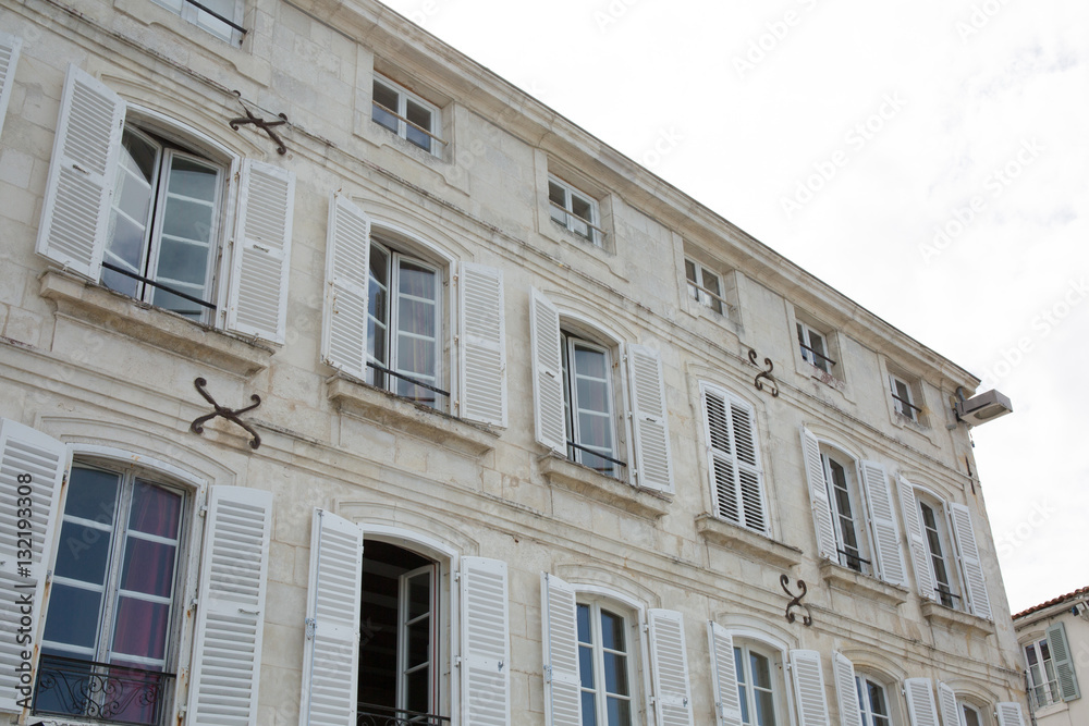 Facade of beautiful classic house and typical of the coast Charentaise in france or the island of Ré Facade of beautiful classic house and typical of the coast Charentaise in france or the island of Ré