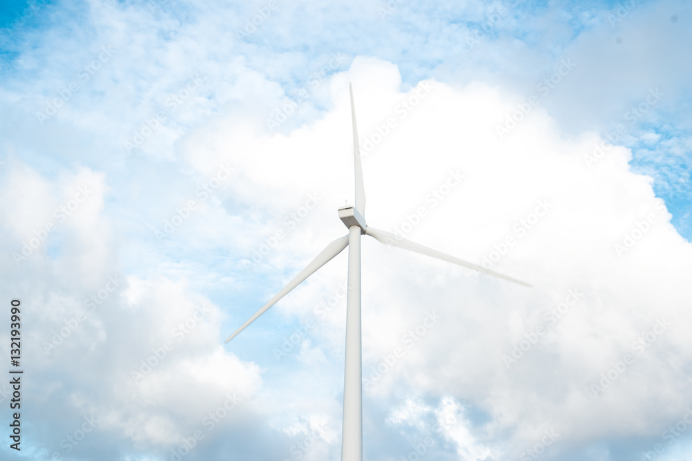 Wind turbines. Ecology wind against cloudy sky background with c Wind turbines. Ecology wind against cloudy sky background with c