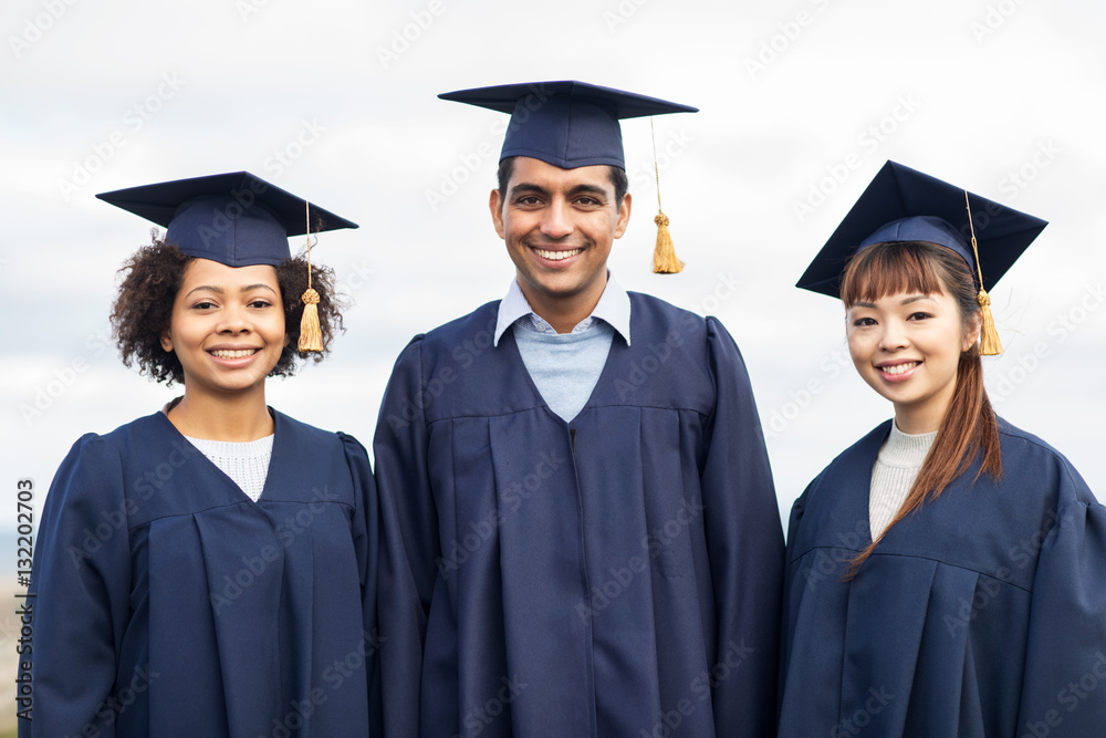 happy students or bachelors in mortar boards happy students or bachelors in mortar boards