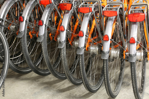 rear wheels and mudguard of orange bicycle
