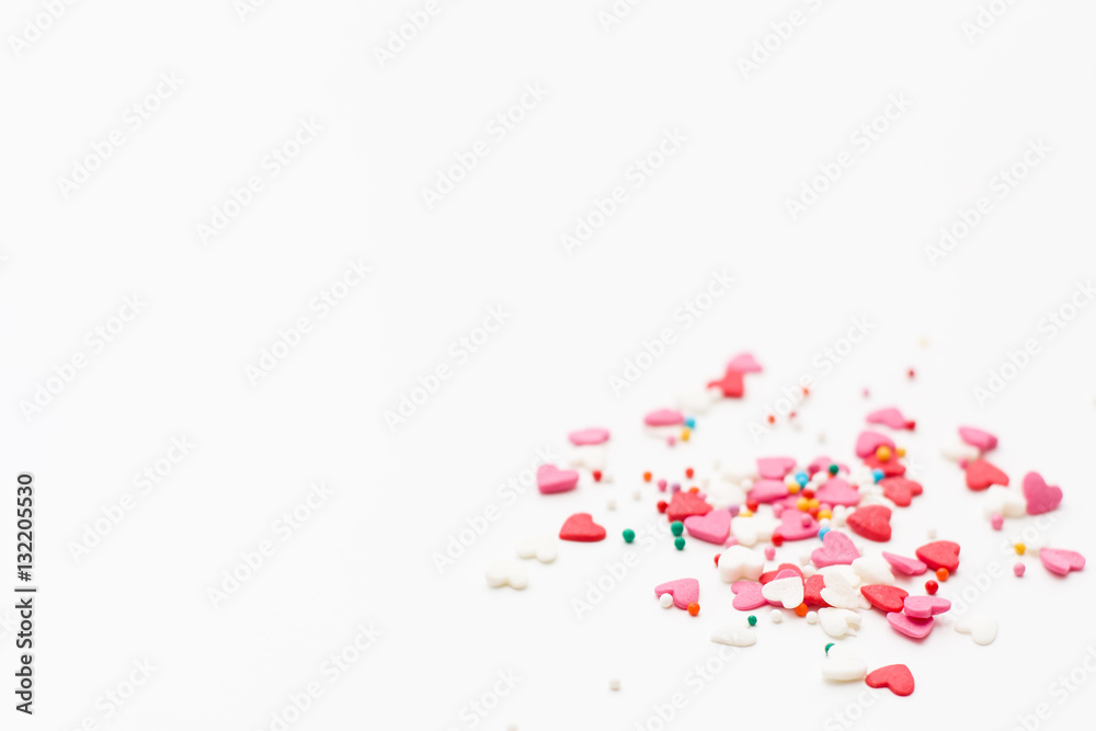 a few small hearts on a white background. Festive background for Valentine's day, birthday, holiday, party a few small hearts on a white background. Festive background for Valentine's day, birthday, holiday, party