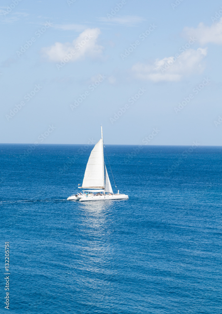 White Sailboat on Blue Sea