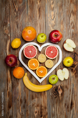 Fruits heart on the wooden background