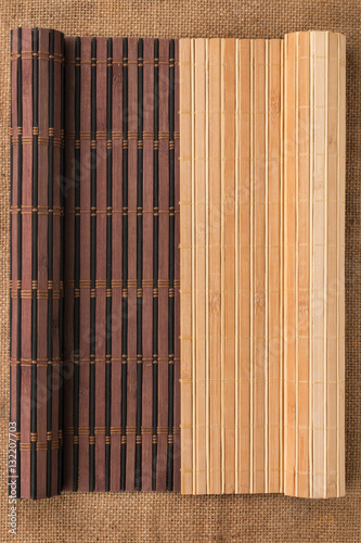 Two bamboo mat twisted in the form of a manuscript on sackcloth