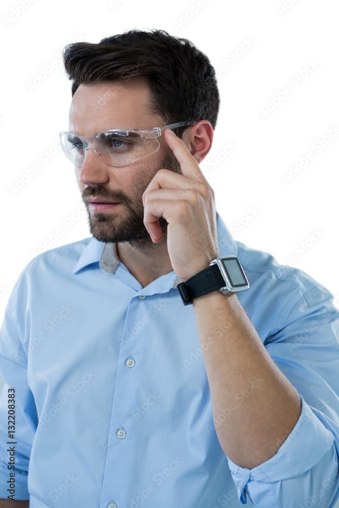 Man wearing protective eyewear and smart watch Man wearing protective eyewear and smart watch