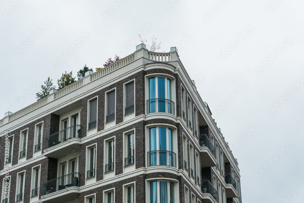 Fototapeta premium Modern Urban Apartment Building with Roof Garden