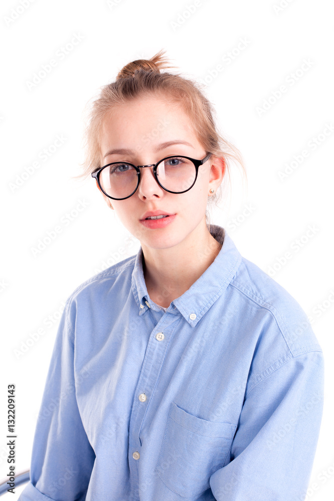 Amazing caucasian girl on chair wearing blue shirt isolated