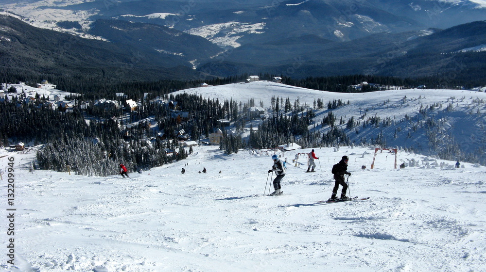 Skiers on snowy slope