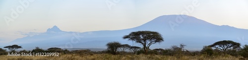 Mount (Mt) Kilimanjaro and Mount (Mt)  Mawenzi (both in in Tanzania) on the left from Satao Elerai Conservancy. Near Amboseli National Park. Kenya.