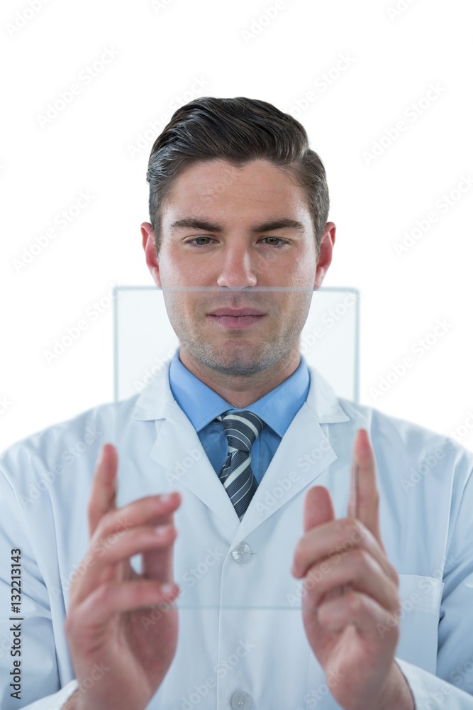 Male doctor using an futuristic digital tablet Male doctor using an futuristic digital tablet
