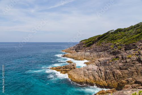 beautiful view, waves crashing into the rocks and mountain