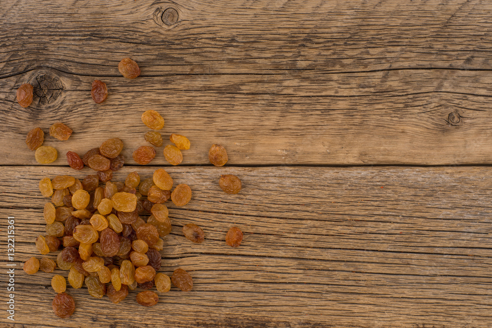 Raisins on the old wooden table. Raisins on the old wooden table.