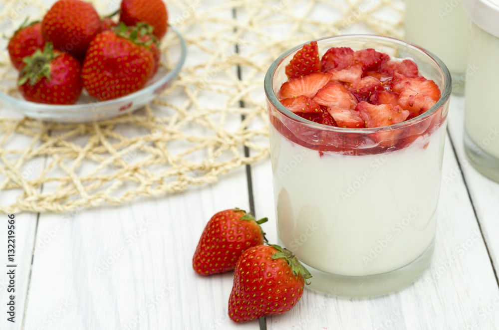 Strawberry yogurt on the white wooden background. Healthy diet Strawberry yogurt on the white wooden background. Healthy diet