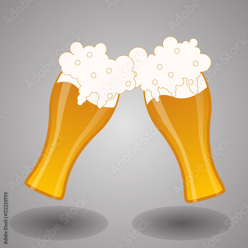 Glass filled of golden light beer with overflowing froth heads.