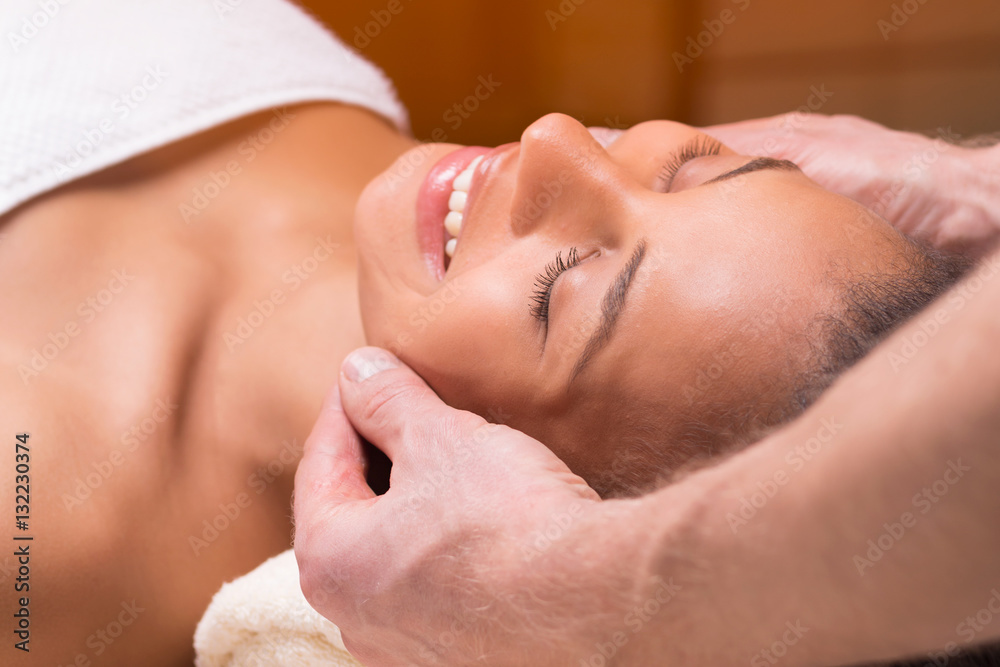 Beautiful woman having face massage Beautiful woman having face massage