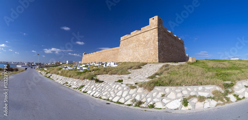 View from the coastal town of Mahdia in Mahdia Governorate of Tunisia, eastern Mediterranean coast with ruins of Fatimid Caliphate and graveyard.