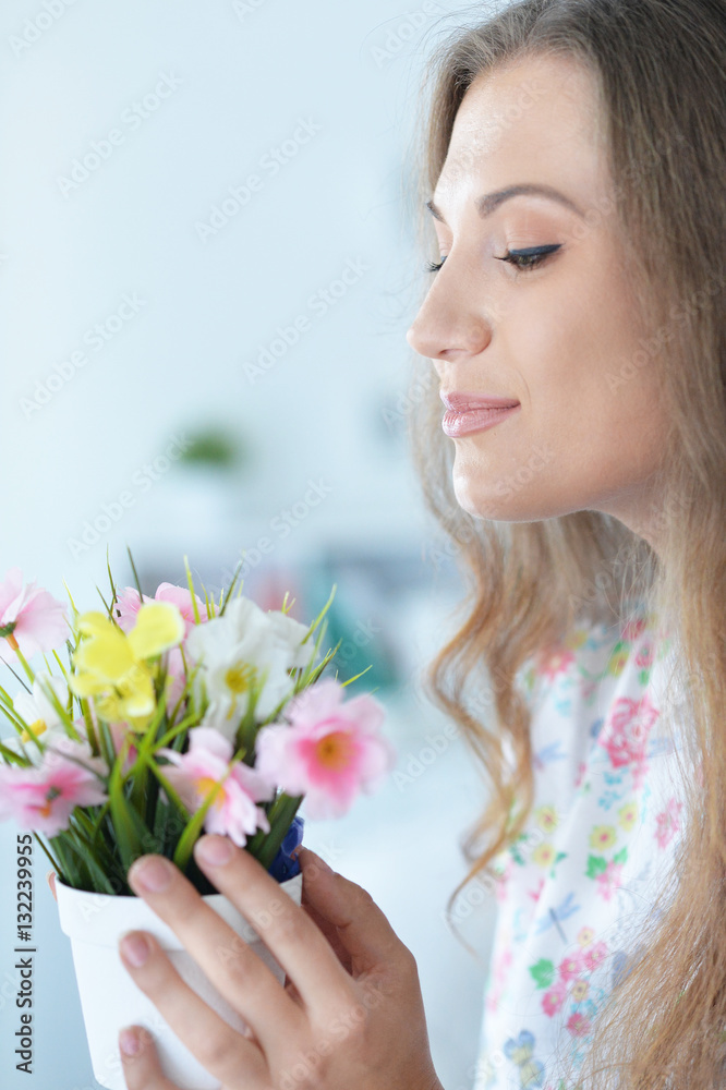 Fototapeta premium beautiful young woman with flowers
