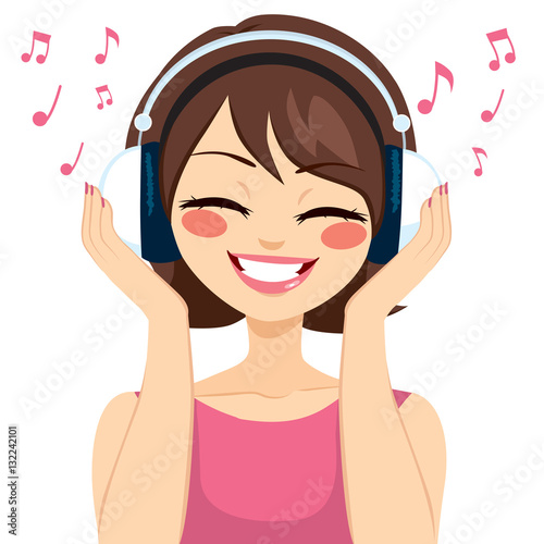 Beautiful young brunette woman listening music with earphones