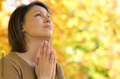 young woman praying photo