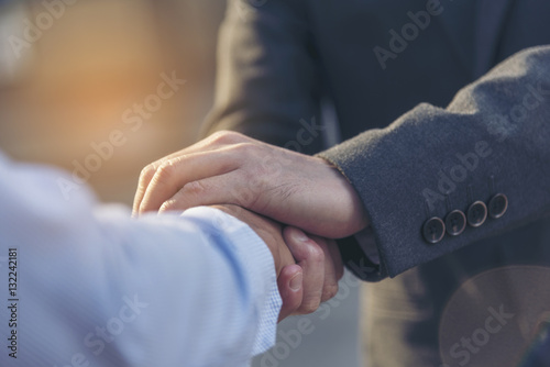 Trust Promise Concept. Honest Lawyer Partner with Professional Team make Law Business Agreement after Complete Deal. Ethics Business people handshake, touch and Respect customer to trust partnership. photo