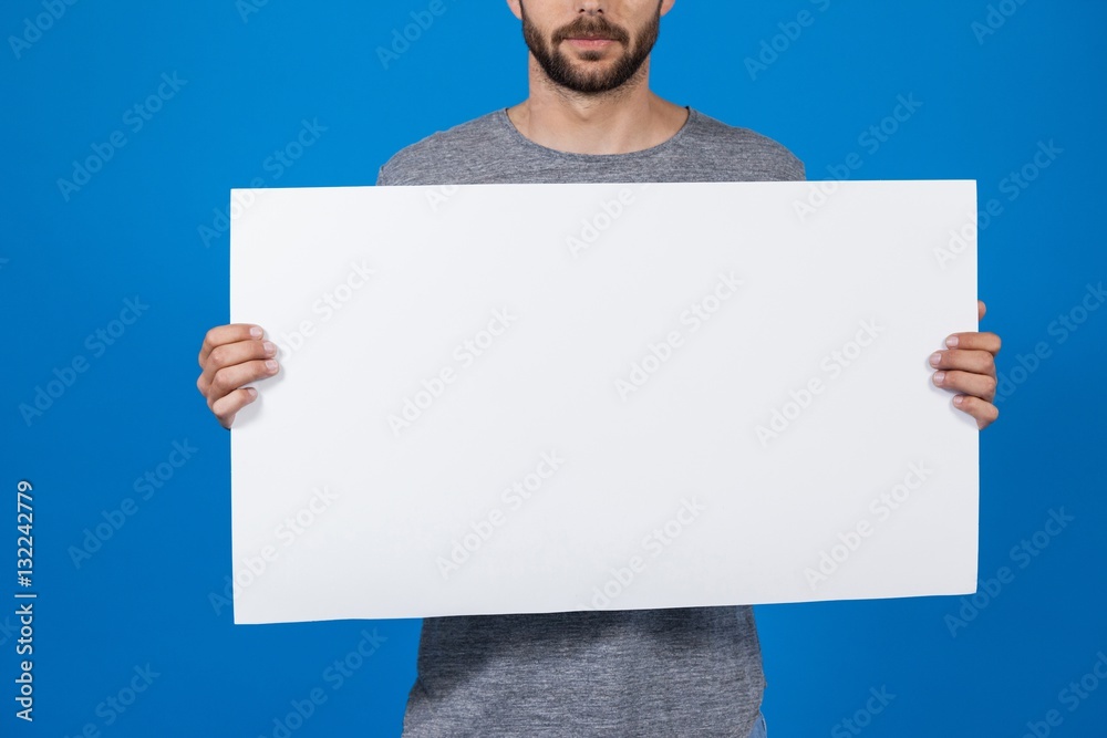 Man holding a blank placard Man holding a blank placard