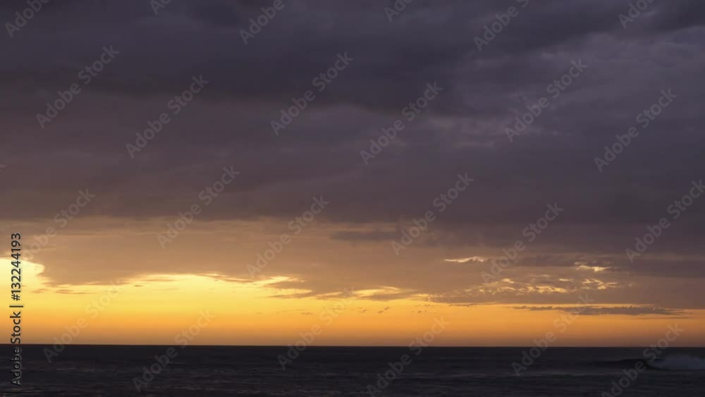 Timelapse shot of clouds rolling over seascape. Beautiful view ocean against orange cloudscape. Scenic view of glowing dramatic sky. 4K resolution.
Timelapse shot of clouds rolling over seascape. Beautiful view ocean against orange cloudscape. Scenic view of glowing dramatic sky. 4K resolution.