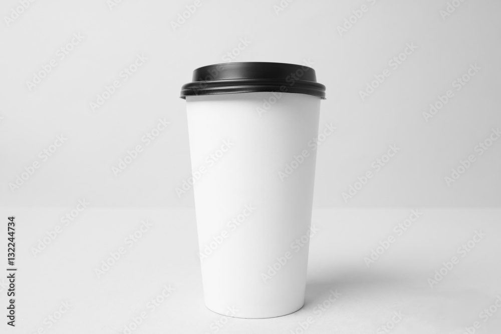 Blank white paper cup with a black cap Blank white paper cup with a black cap