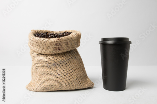 Black paper cup mockup with coffee sack