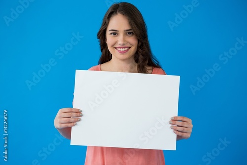 Woman holding a blank placard 