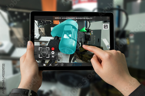 Industrial 4.0 , Augmented reality concept. Hand holding tablet with AR service , maintenance application and calling technician for check destroy part of smart machine motor in smart factory