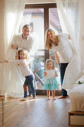Cheerful family of four people.