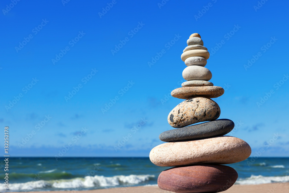 Naklejka premium Concept of balance and harmony. stones balance on the background
