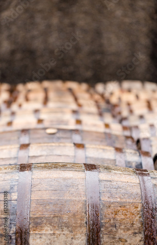 Whisky barrels full of whiskey in Scottish traditional distiller