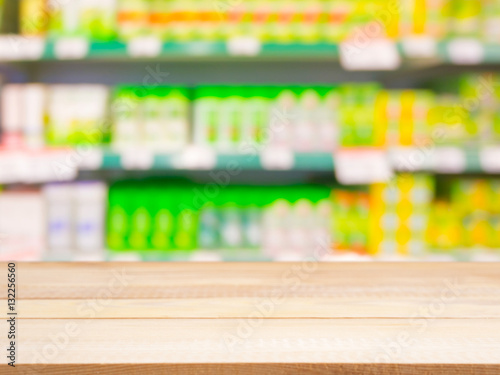 Blurred colorful supermarket products on shelves © fascinadora