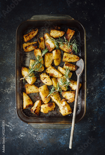 Wallpaper Mural Overhead view of roasted potatoes in a pan garnished with rosemary Torontodigital.ca