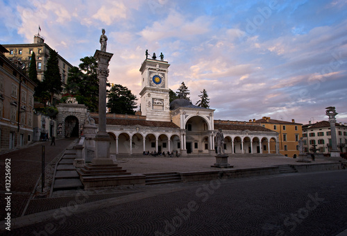 Piazza Libertà in Udine with the Loggia of San Giovanni and column of justice at sunset. Italy.